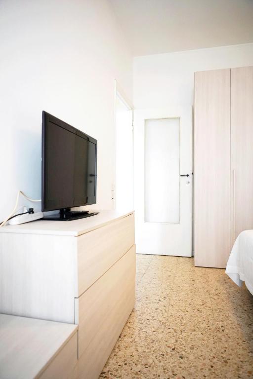 Televízia a/alebo spoločenská miestnosť v ubytovaní Enjoy Apartment Gorla
