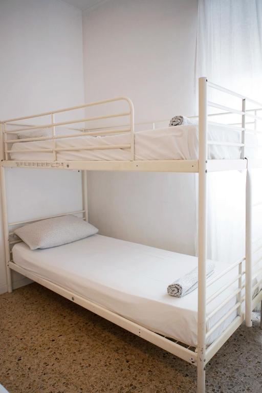 Posteľ alebo postele v izbe v ubytovaní Enjoy Apartment Gorla