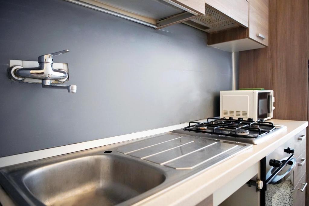 Kuchyňa alebo kuchynka v ubytovaní Enjoy Apartment Gorla