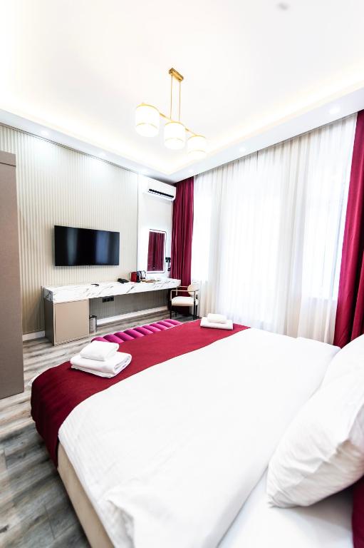 Postel nebo postele na pokoji v ubytování Hidden Pearls Boutique Hotel