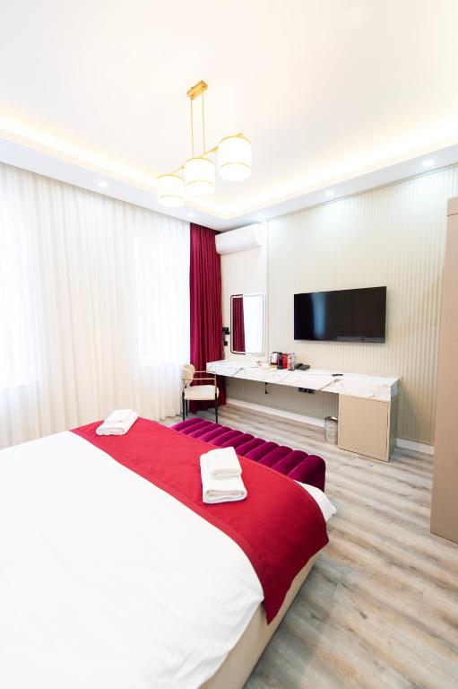 Postel nebo postele na pokoji v ubytování Hidden Pearls Boutique Hotel