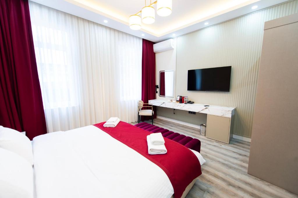 Postel nebo postele na pokoji v ubytování Hidden Pearls Boutique Hotel