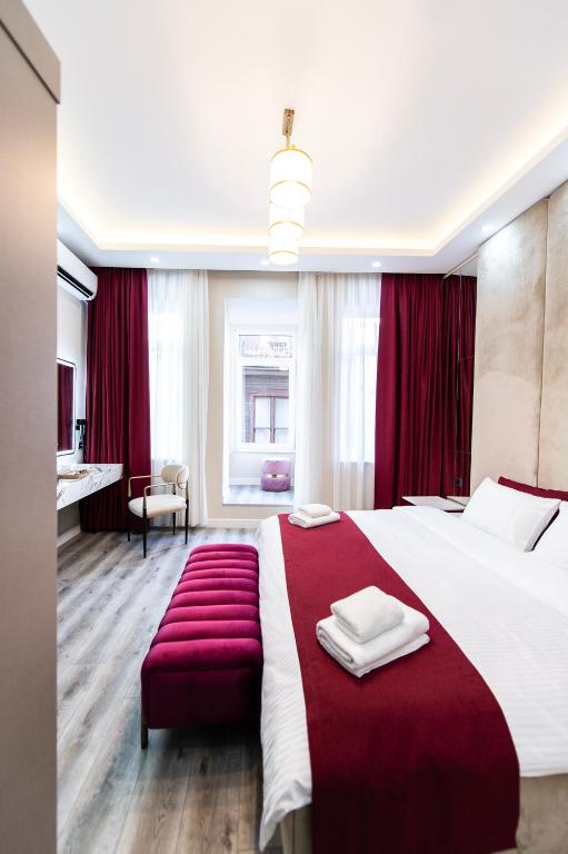 Postel nebo postele na pokoji v ubytování Hidden Pearls Boutique Hotel
