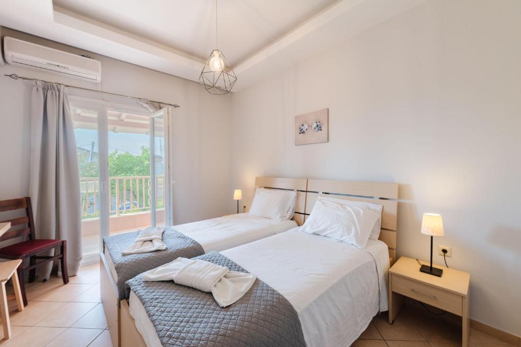 Postel nebo postele na pokoji v ubytování Spyridoula Resort in Corfu