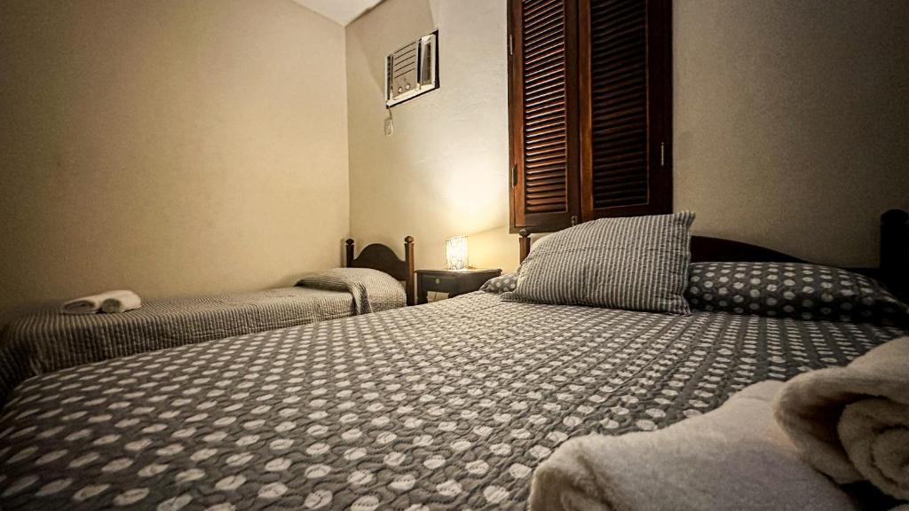 Postel nebo postele na pokoji v ubytování Pousada Villa Aman