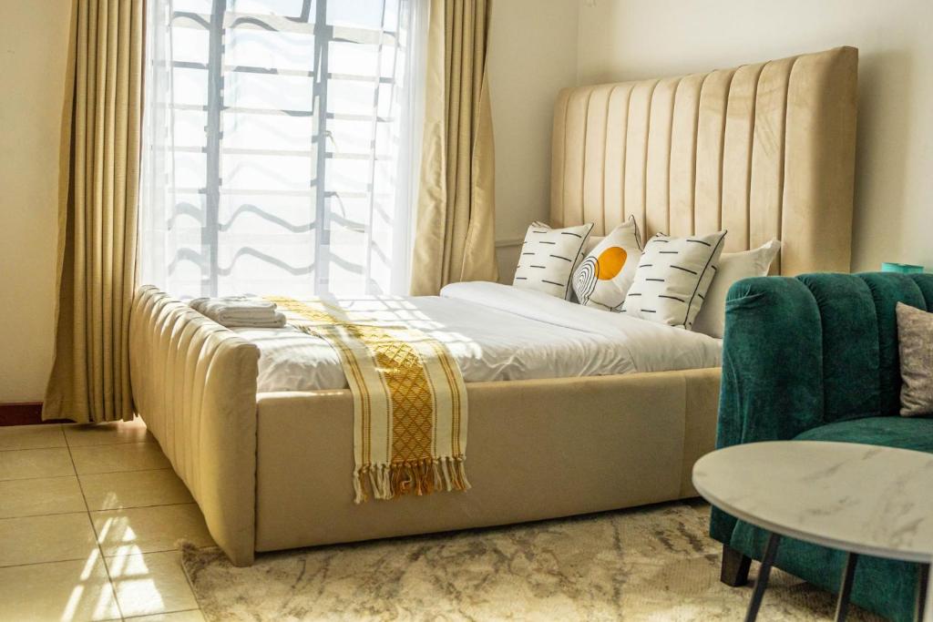 Postel nebo postele na pokoji v ubytování South suites