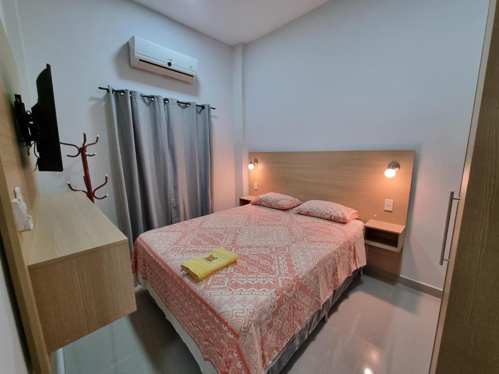Postel nebo postele na pokoji v ubytování Hotel Karanda´y