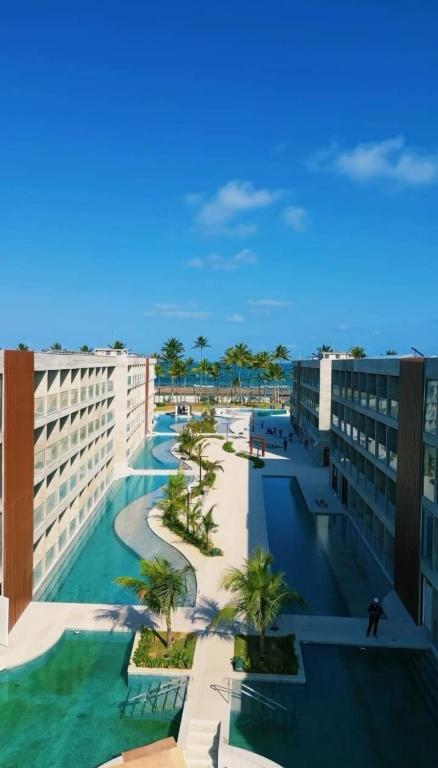 arial view of a resort with palm trees and buildings at Porto Alto in Ipojuca