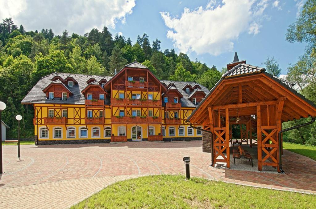 a large building with a pavilion in front of it at Dom zdravia - KÚPELE PIENINY in Červený Kláštor