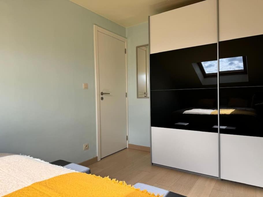 Postel nebo postele na pokoji v ubytování Vakantiewoning dichtbij zee