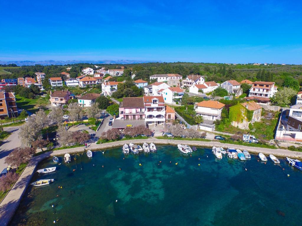 an aerial view of a marina with boats in the water at Apartman Ivka A1 in Petrcane