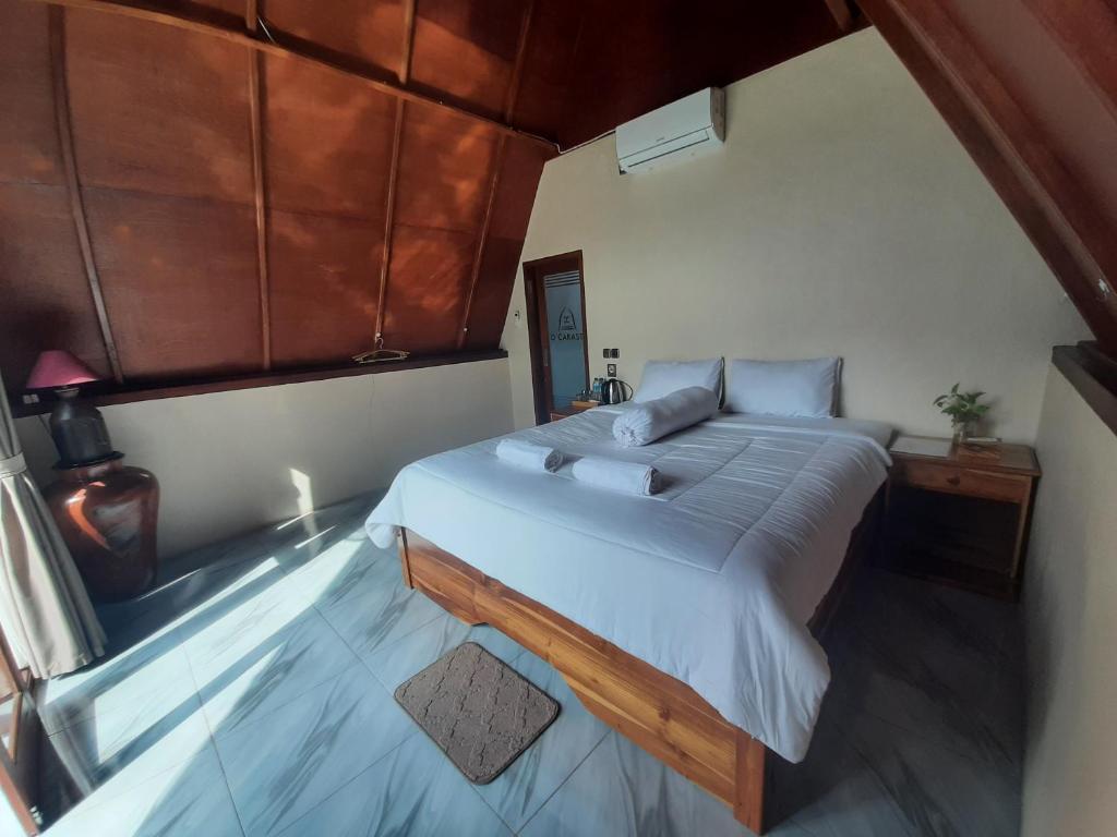 Postel nebo postele na pokoji v ubytování D' Carasti Bungalow