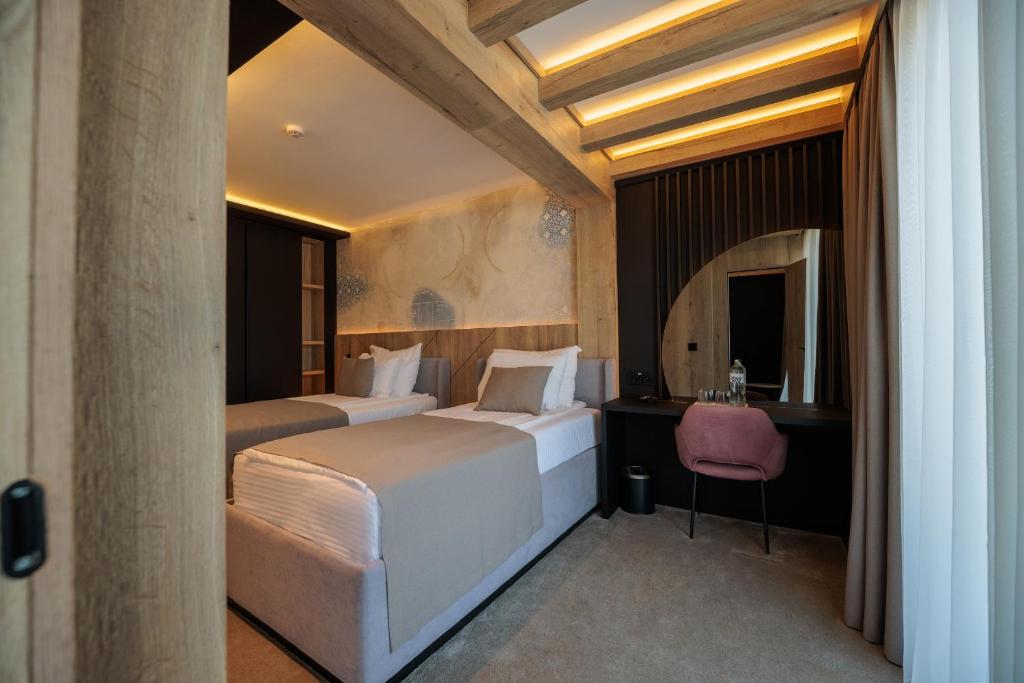 Krevet ili kreveti u jedinici u okviru objekta HOTEL ROYAL MOUNTAIN