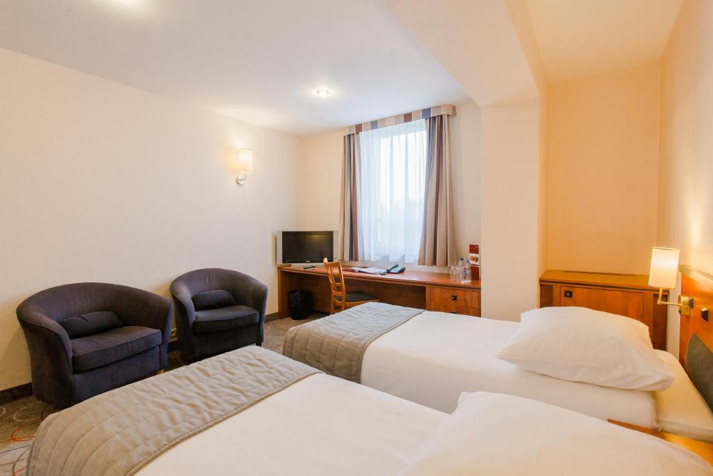 Posteľ alebo postele v izbe v ubytovaní Qubus Hotel Głogów
