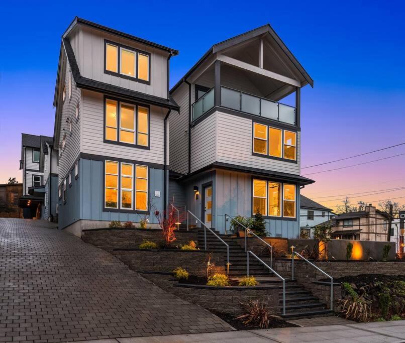 a large house with lights on inside of it at New House in peaceful and trendy Central District in Seattle