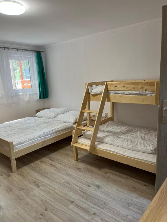 Postel nebo postele na pokoji v ubytování Bungalov Elite
