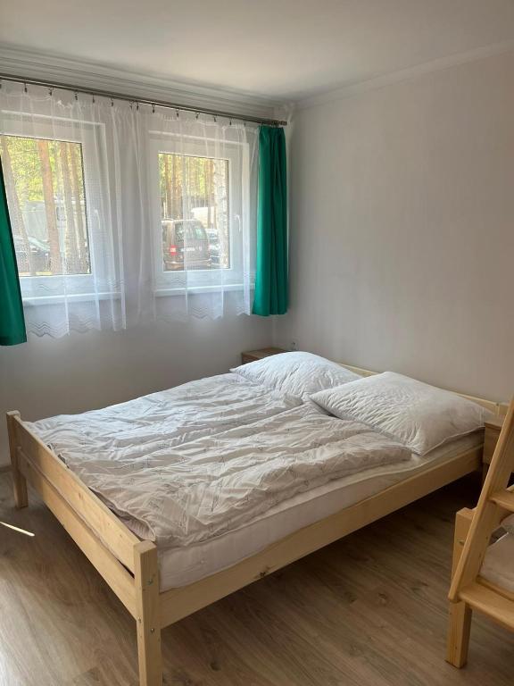 Postel nebo postele na pokoji v ubytování Bungalov Elite