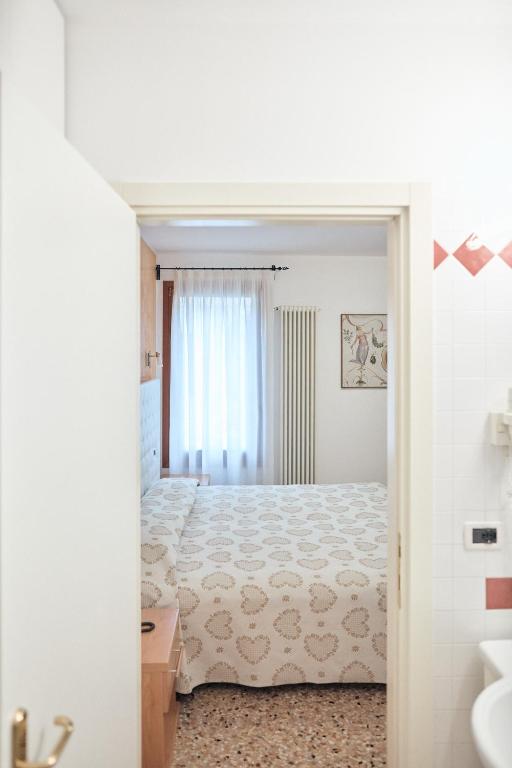 Postel nebo postele na pokoji v ubytování Hotel Roma