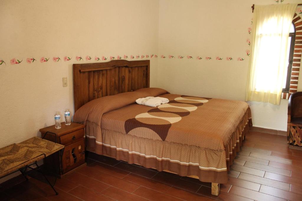 Postel nebo postele na pokoji v ubytování Posada Guayacán Tepoztlán