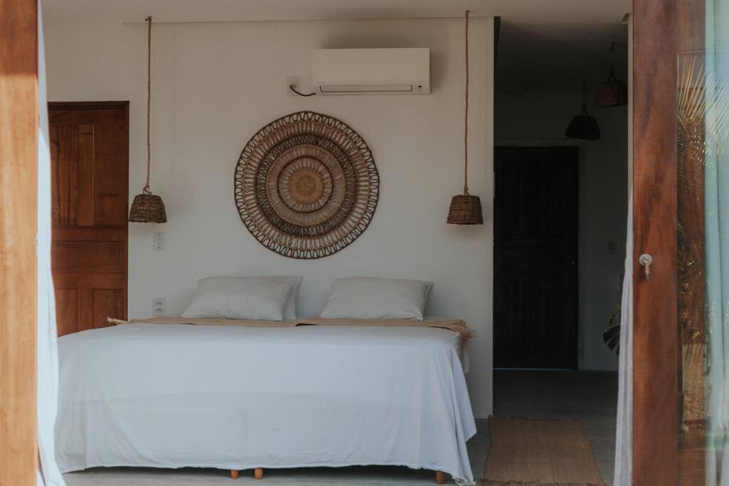 Ένα ή περισσότερα κρεβάτια σε δωμάτιο στο Breezy Chalet - Chalé Havaí