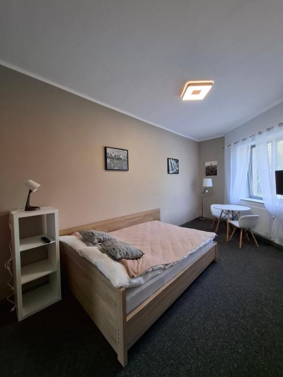 Ένα ή περισσότερα κρεβάτια σε δωμάτιο στο Apartament Maja