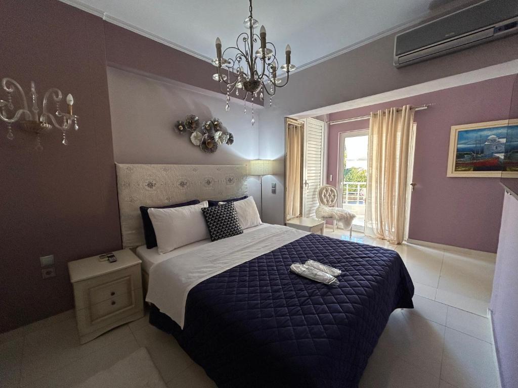 Postel nebo postele na pokoji v ubytování Palataki Residence