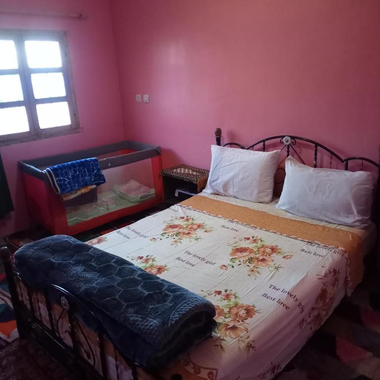 Postel nebo postele na pokoji v ubytování Dar Brahim Resto Beds