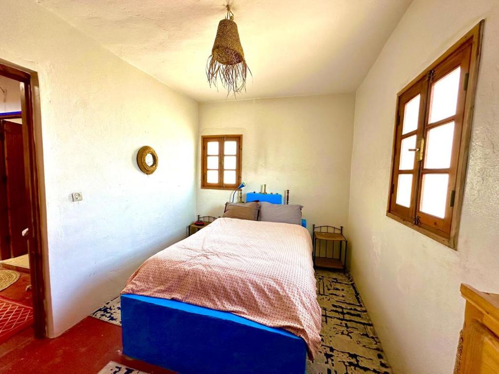 Postel nebo postele na pokoji v ubytování Hippie Chic - Room L'oued