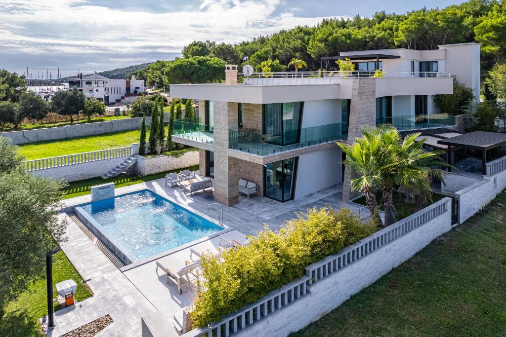 an aerial view of a house with a swimming pool at Luxury Villa Con Brio in Pomer