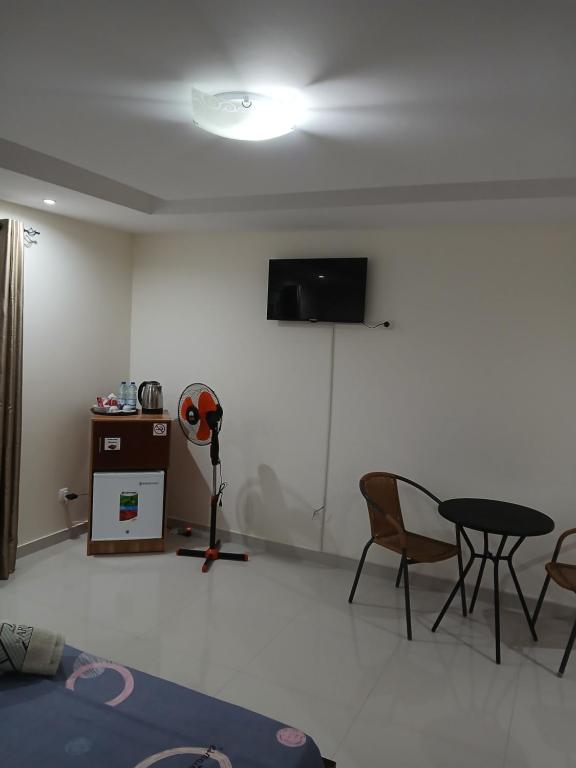 TV a/nebo společenská místnost v ubytování Nifa House