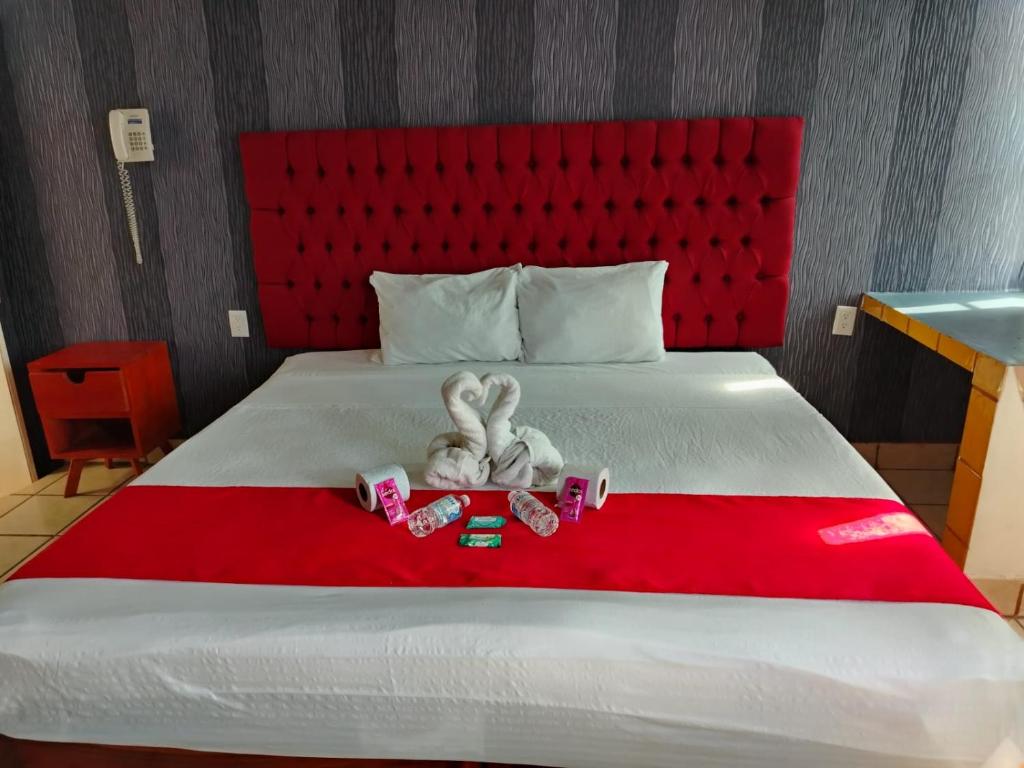 Postel nebo postele na pokoji v ubytování Hotel La Intimidad