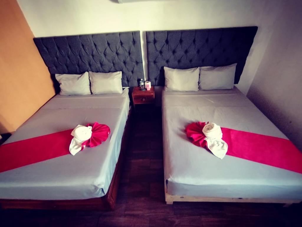 Postel nebo postele na pokoji v ubytování Hotel La Intimidad