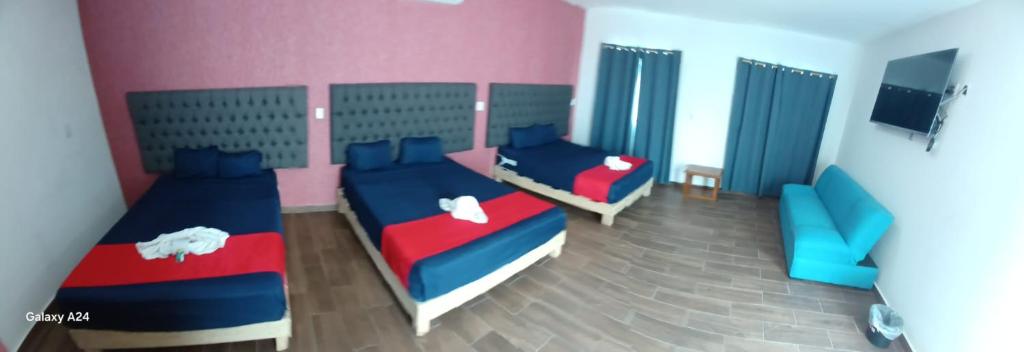 Postel nebo postele na pokoji v ubytování Hotel La Intimidad