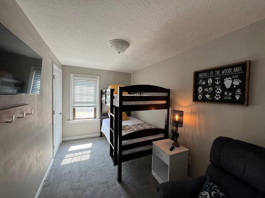 a small room with two bunk beds in it at Spacious Relaxing Baltimore Home with Hot Tub in Baltimore