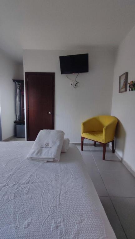Postel nebo postele na pokoji v ubytování Hostal Casa Morada