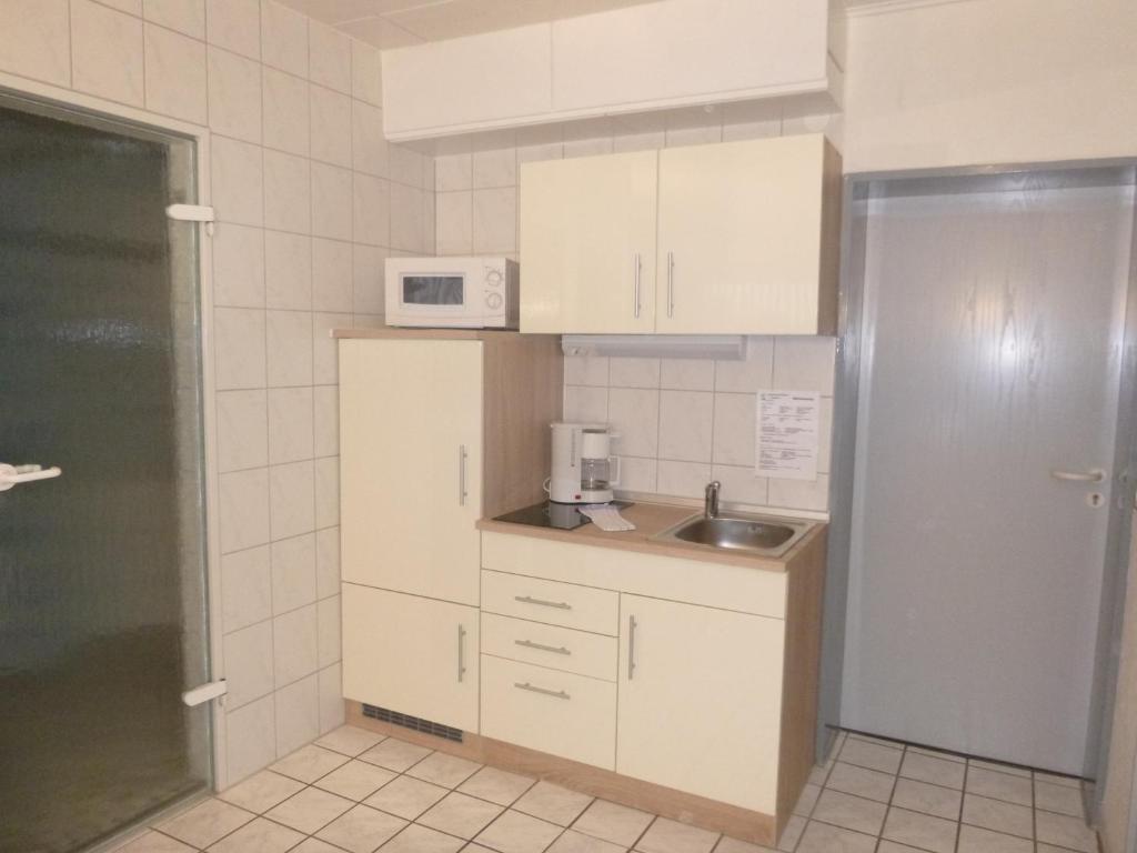 Kuchyň nebo kuchyňský kout v ubytování Haus Delphin