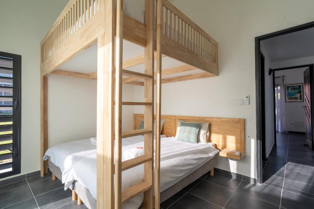 Postel nebo postele na pokoji v ubytování Kaz Corail Villa exceptionnelle
