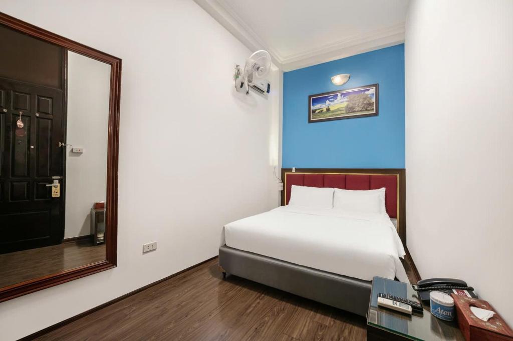 Postel nebo postele na pokoji v ubytování A25 Hotel - 197 Thanh Nhàn