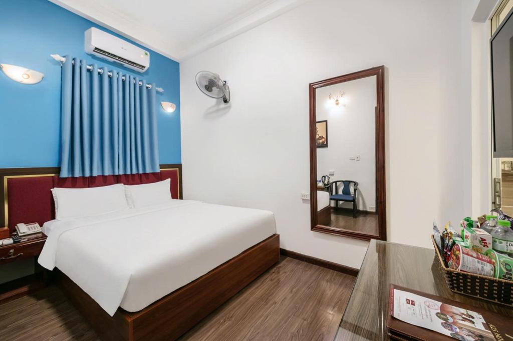 Postel nebo postele na pokoji v ubytování A25 Hotel - 197 Thanh Nhàn