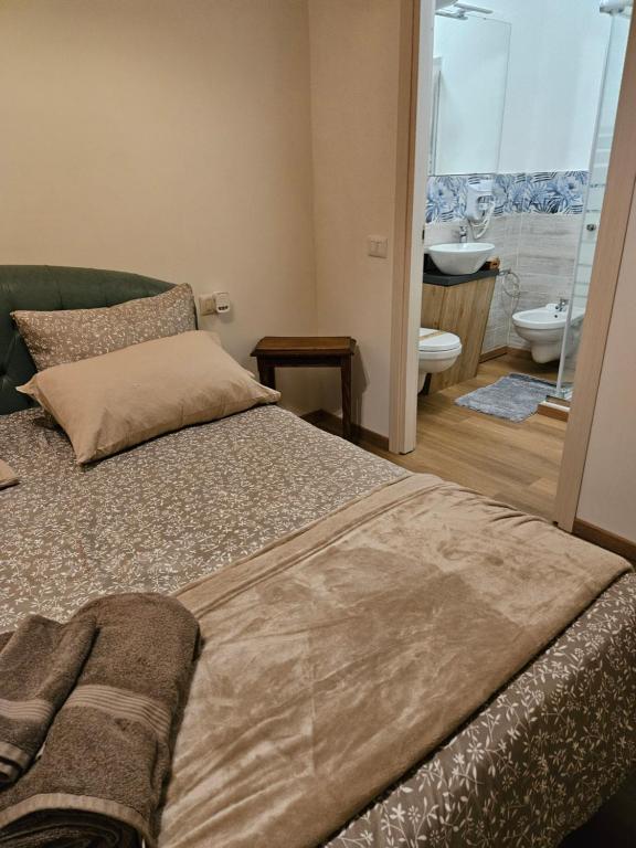 Postel nebo postele na pokoji v ubytování Mxp Room Busto