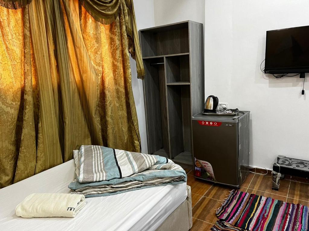 TV a/nebo společenská místnost v ubytování Jana Pyramids view inn