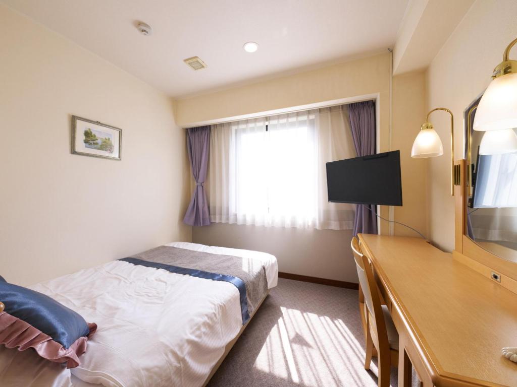TV a/nebo společenská místnost v ubytování Hotel Areaone Wadayama