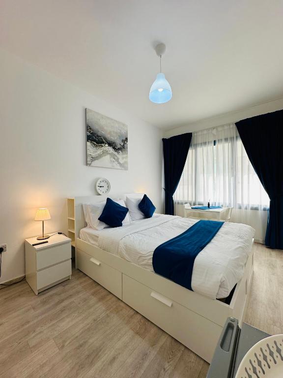 Postel nebo postele na pokoji v ubytování SG Homes