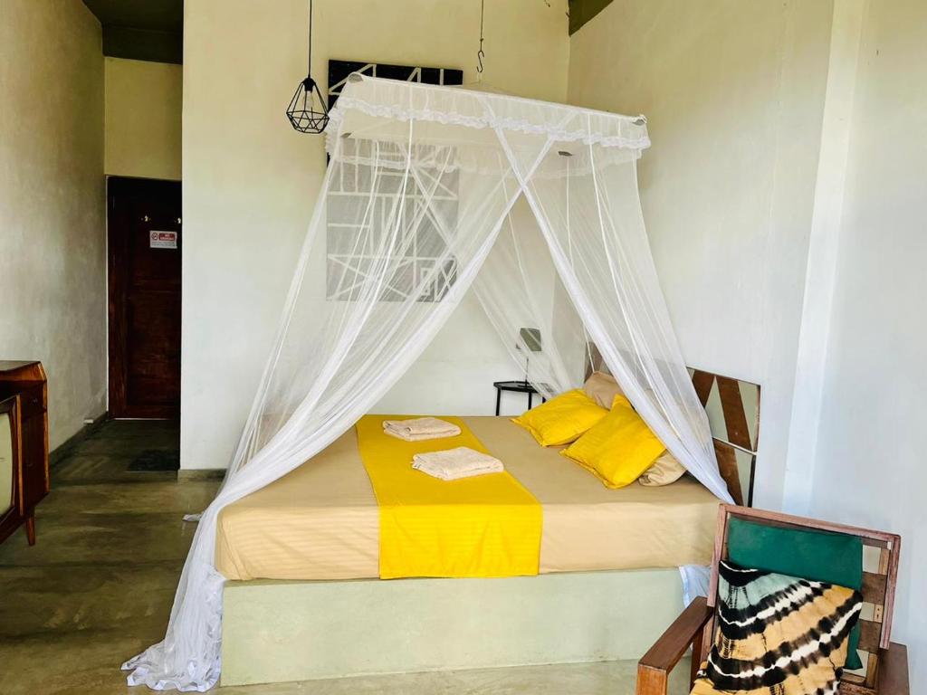 Postel nebo postele na pokoji v ubytování The Traveller Kandy