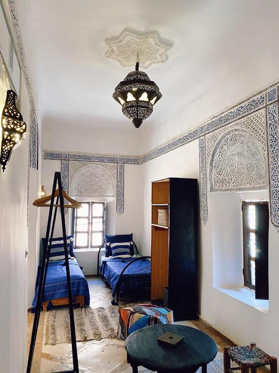 Postel nebo postele na pokoji v ubytování Riad Sidi Radoine