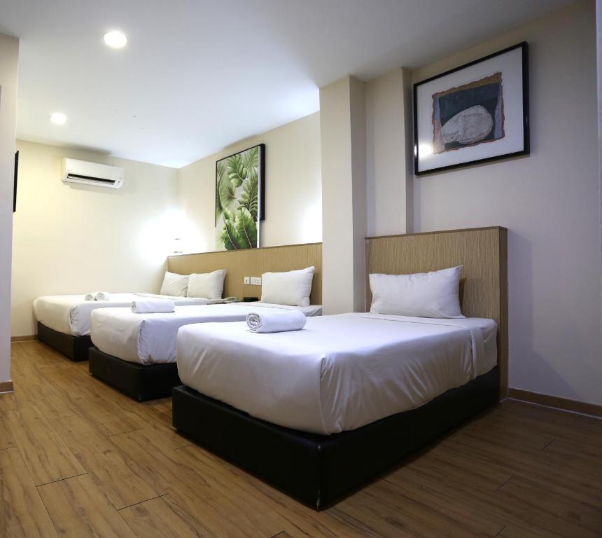 Postel nebo postele na pokoji v ubytování ECO Hotel at BBCC