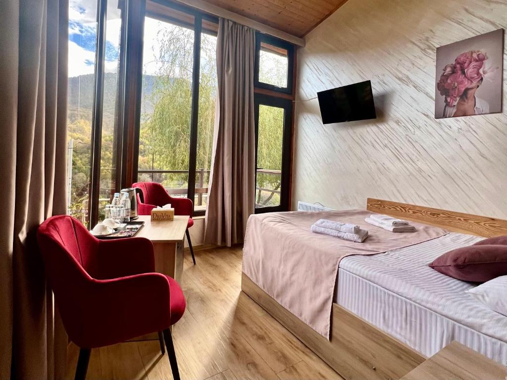 Postel nebo postele na pokoji v ubytování DiliVita Rest House