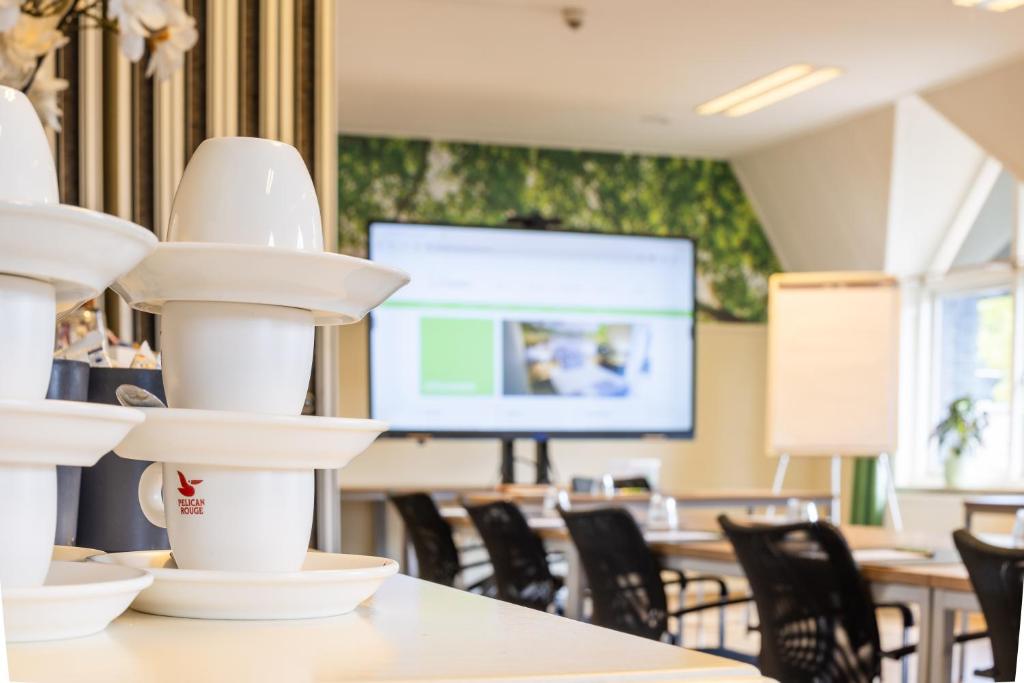 TV a/nebo společenská místnost v ubytování Hotel Restaurant 'de Vossenberg'