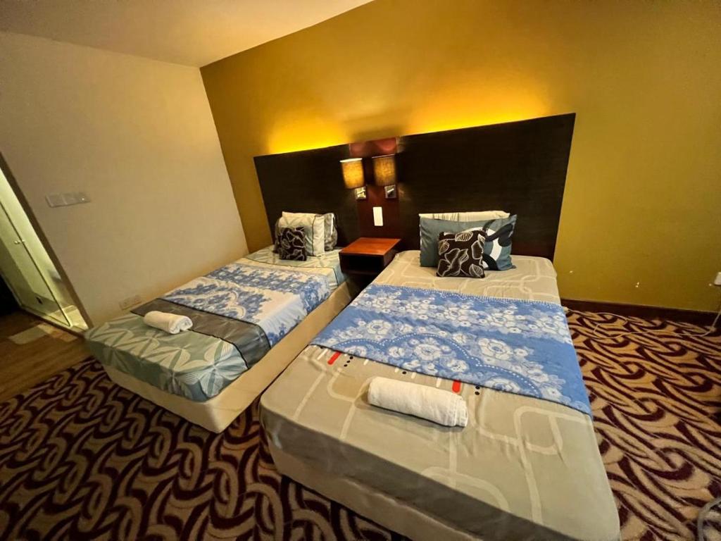 Postel nebo postele na pokoji v ubytování Faina Homestay SCSP Ming Garden Resident Kota Kinabalu