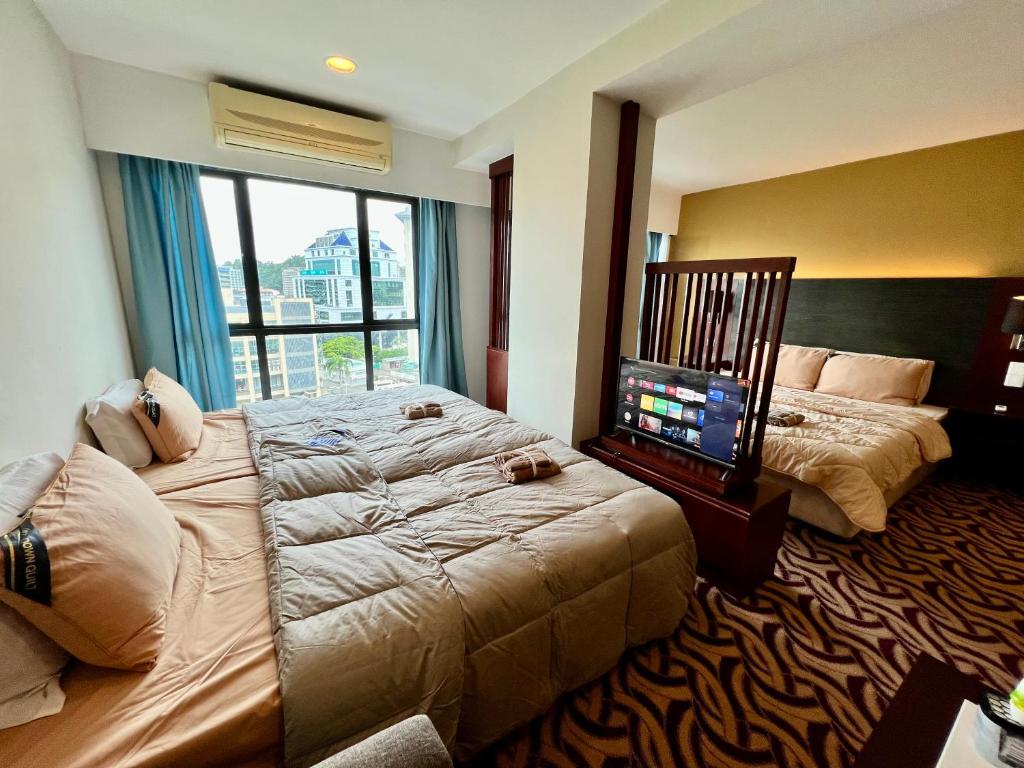 Postel nebo postele na pokoji v ubytování Faina Homestay SCSP Ming Garden Resident Kota Kinabalu